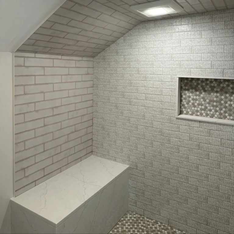 Shower with bevel and rectangular tiles in a brick patterns.