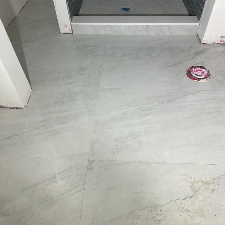 Large stone tiles in a bathroom floor.