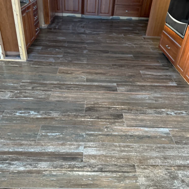 Rustic wood tile in a kitchen floor.