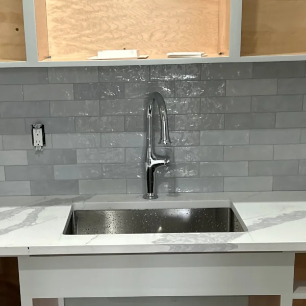 Glossy gray brick backsplash tile