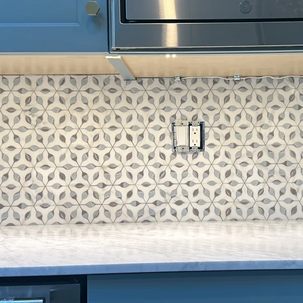 kitchen backsplash with hexagonal leaf tile installation
